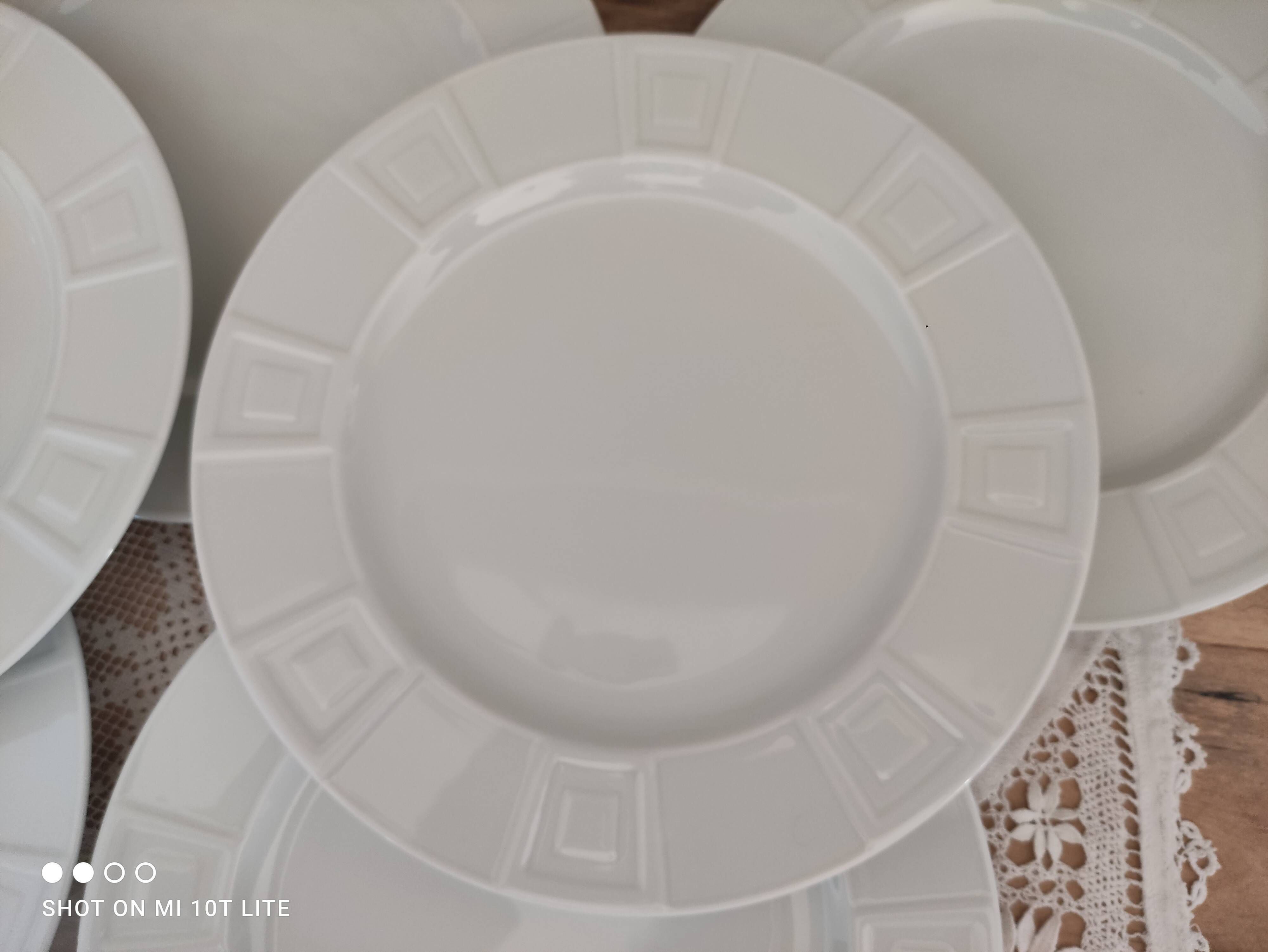 Set of 7 flat plates in white Limoges porcelain geometric decoration in relief