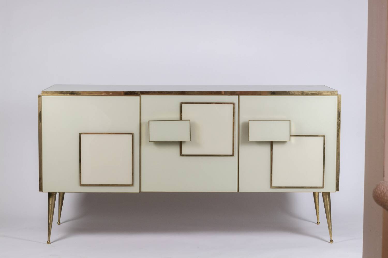 Geometric sideboard in glass and gilded brass. Contemporary Italian work.