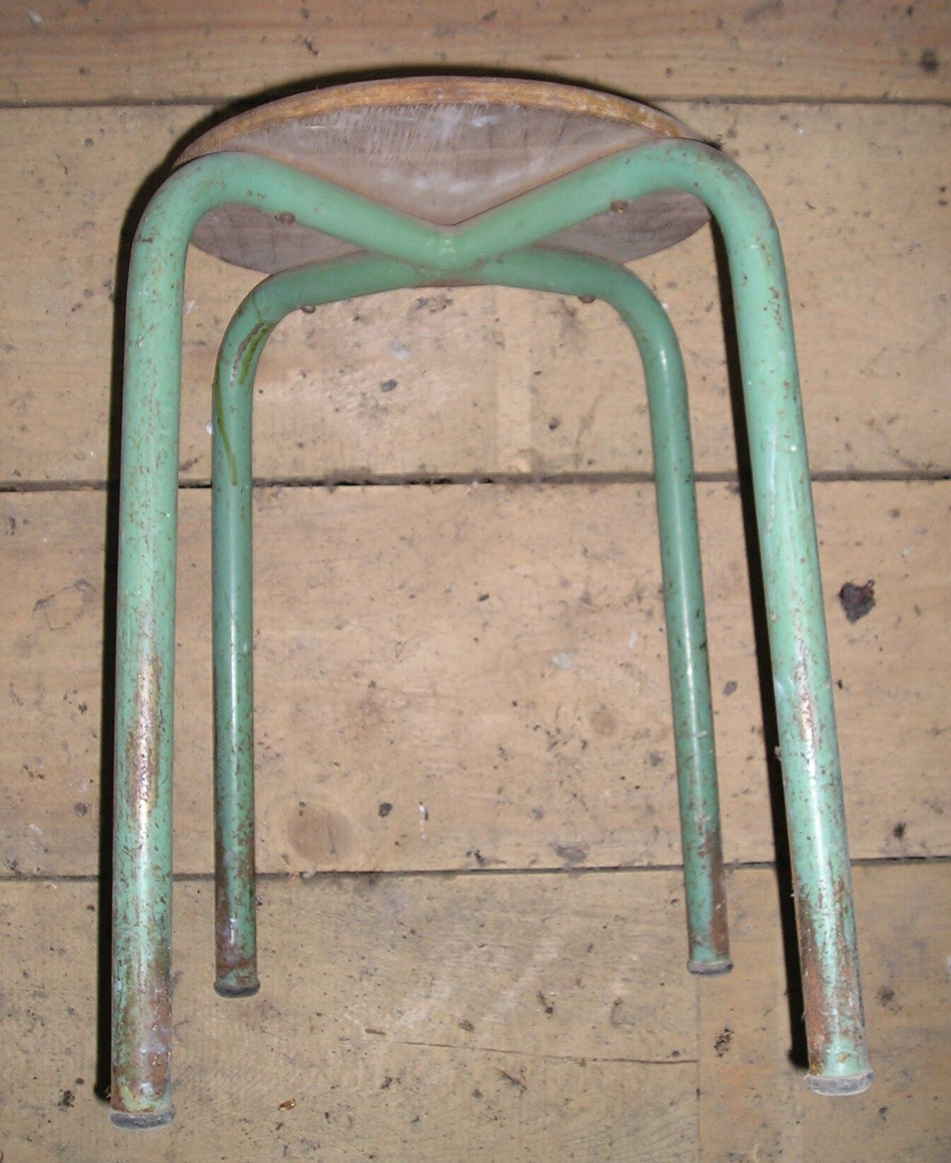 Old school stool made of metal and wood