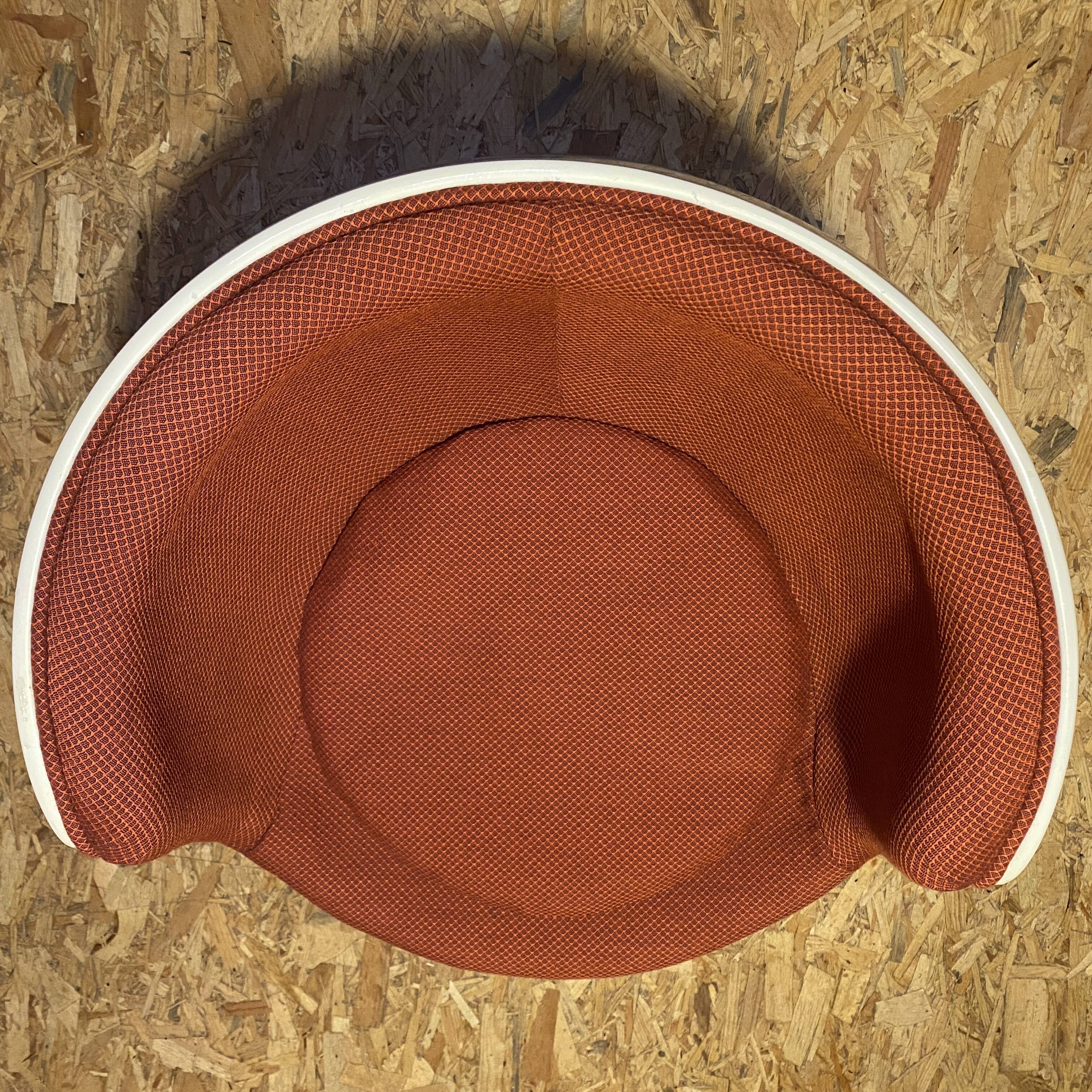 Two cognac-colored swivel chairs made of fiberglass from the 1970s