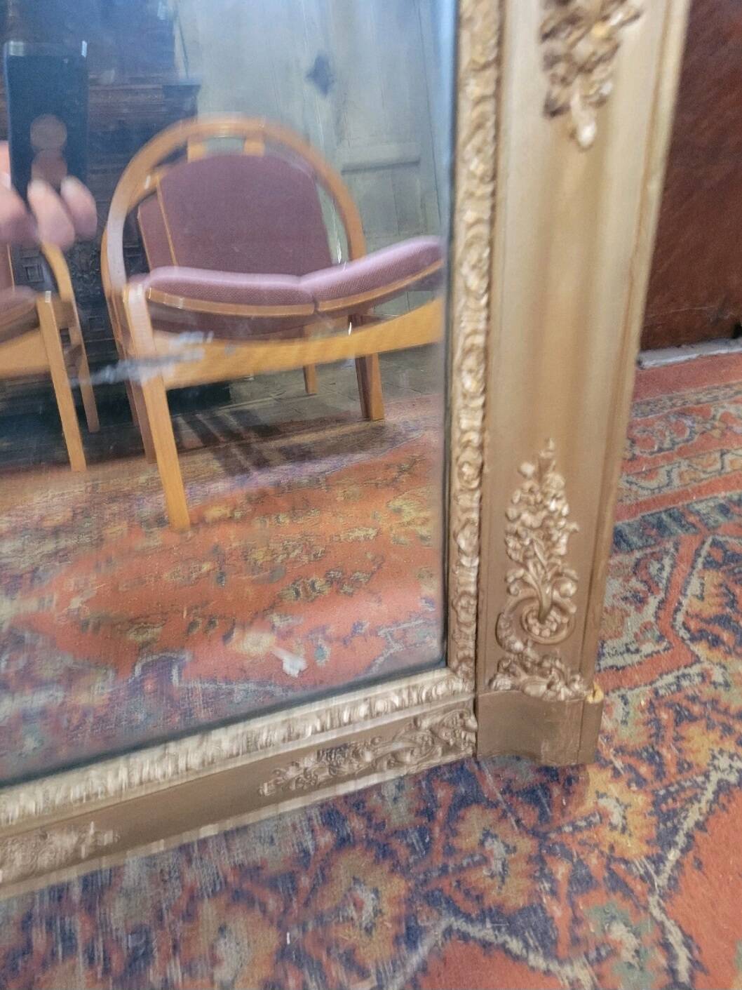 Antique gilded mirror from the 19th century, mercury mirror.