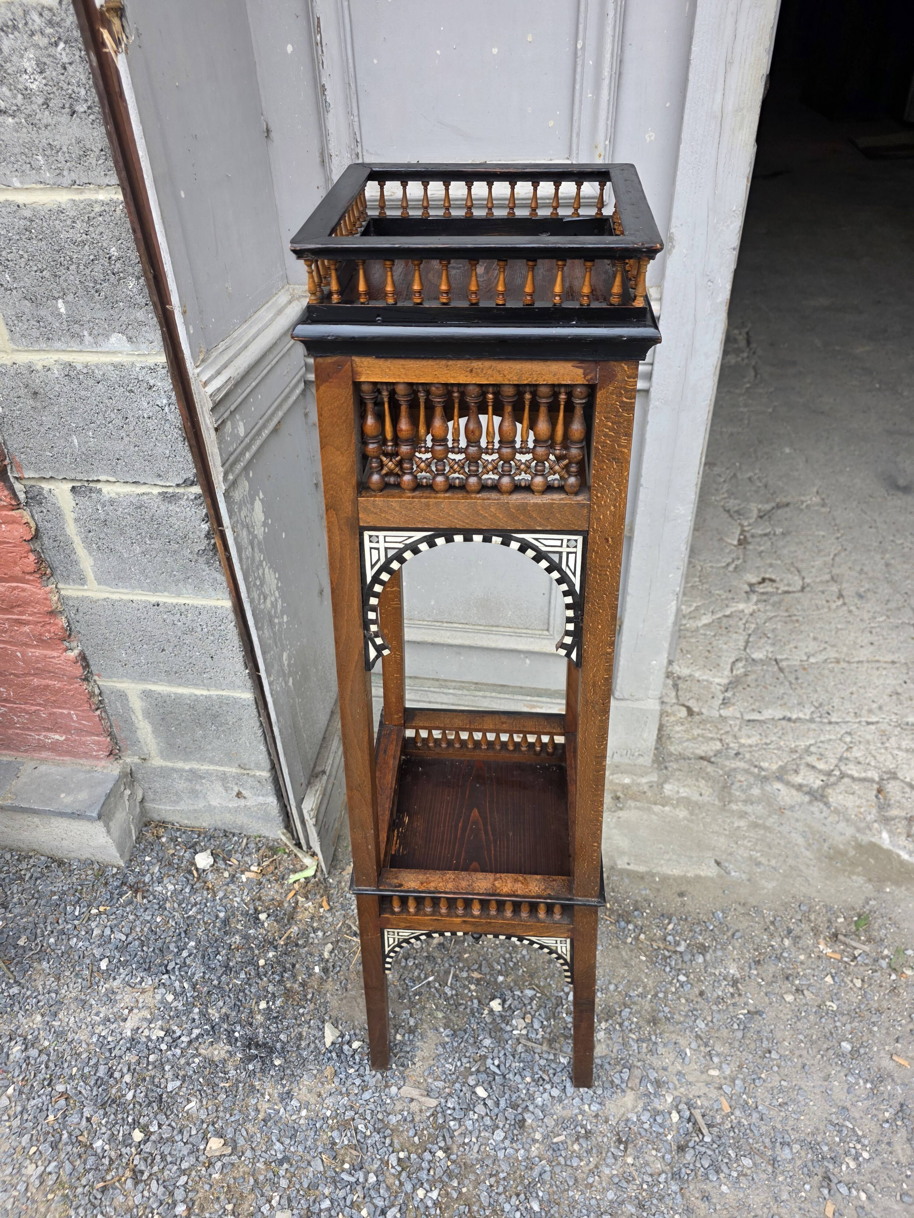 Antique pedestal from the early 20th century.