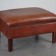 Leather ottoman in classic English style finished with decorative nails