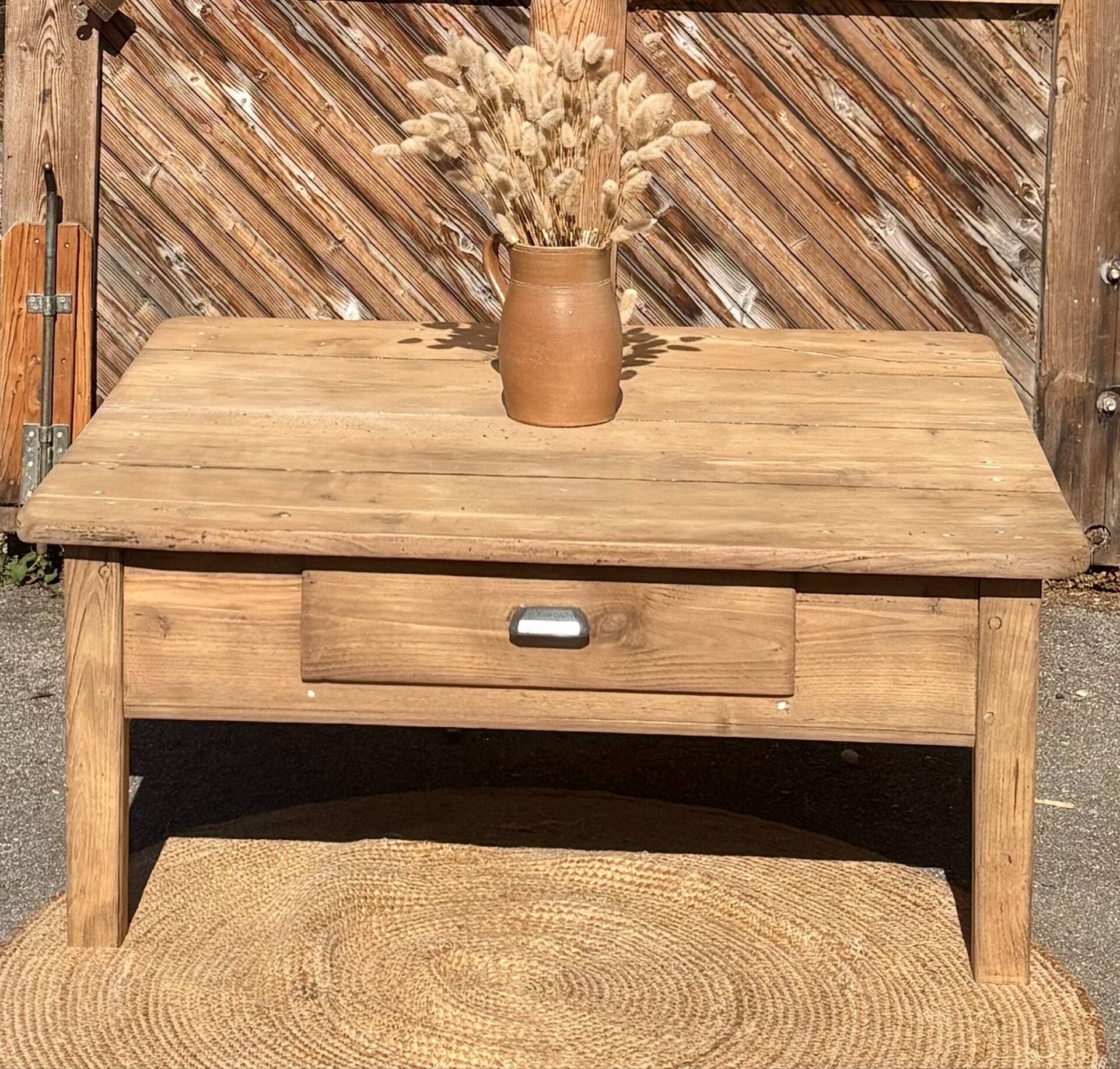 Large square farmhouse coffee table made of raw solid oak.