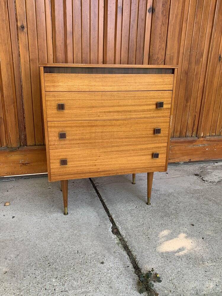 Mid-century brown teak chest of drawers with three drawers, tapered legs from the 1960s.