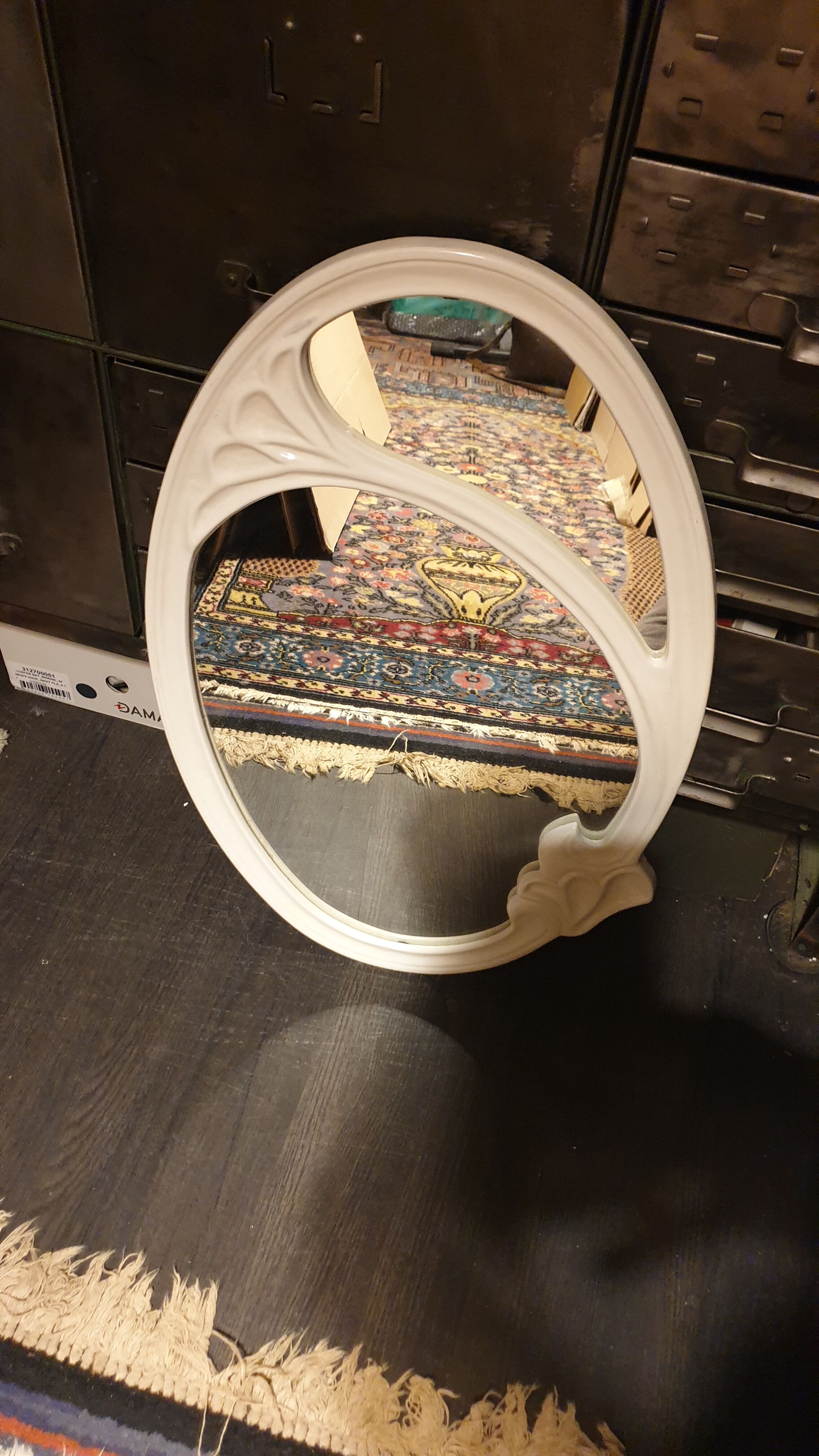 Oval cast iron mirror