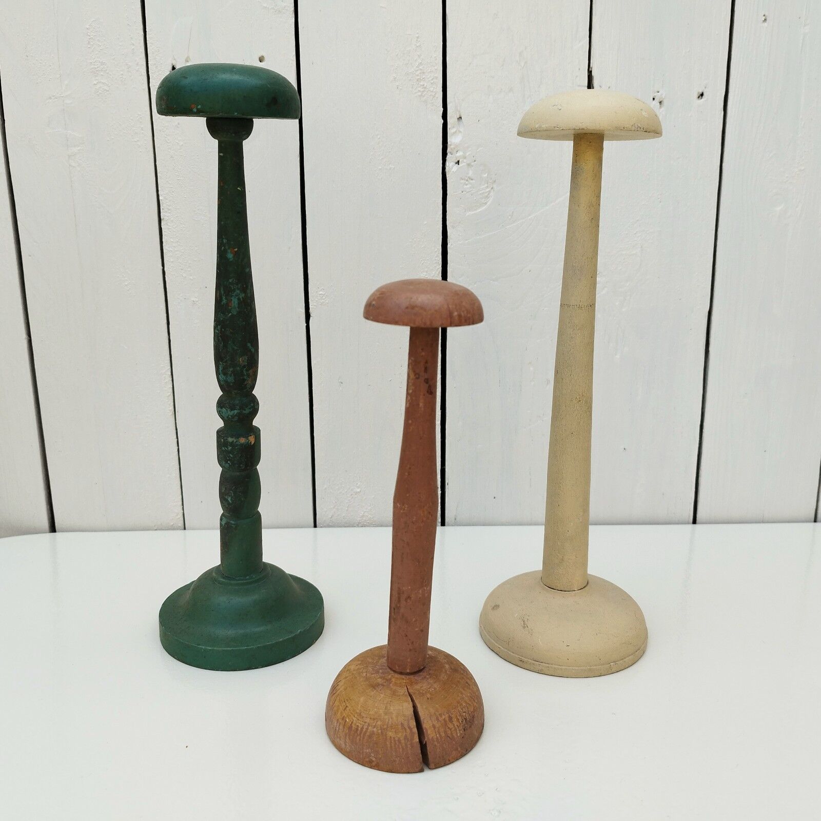 Three vintage wooden hat holders milliner