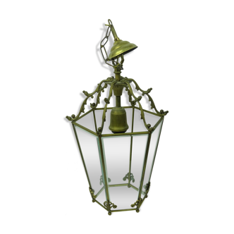 Lustre has brass volutes and bevelled glass
