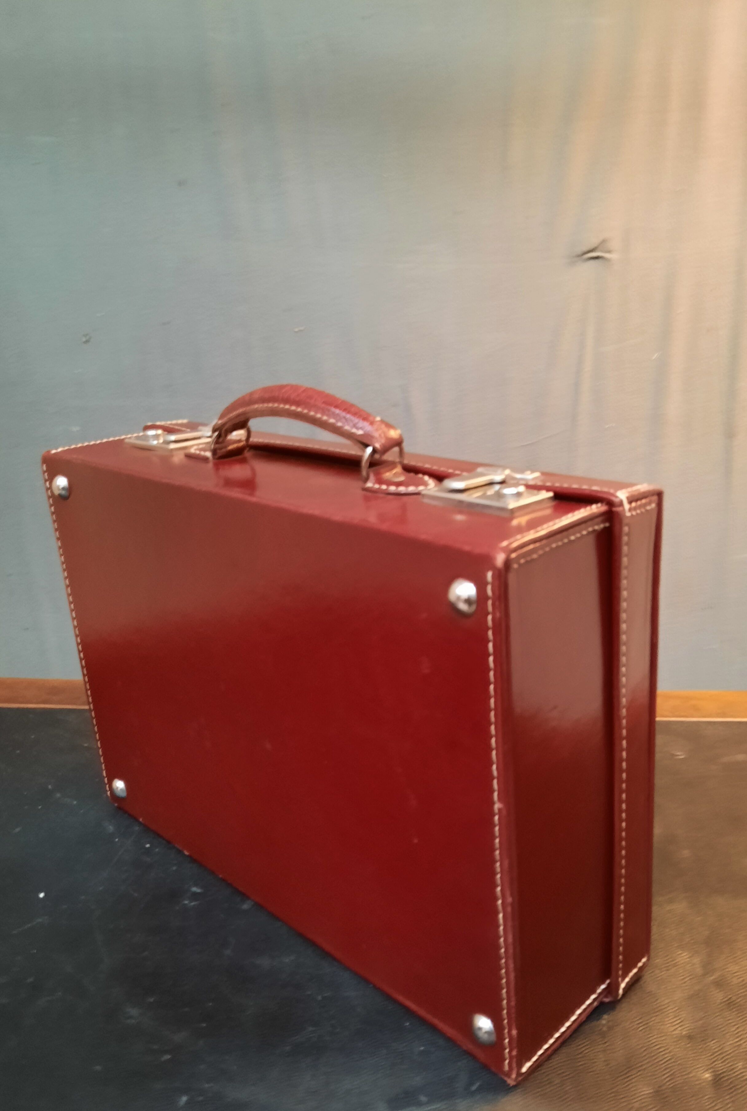 Red leather suitcase