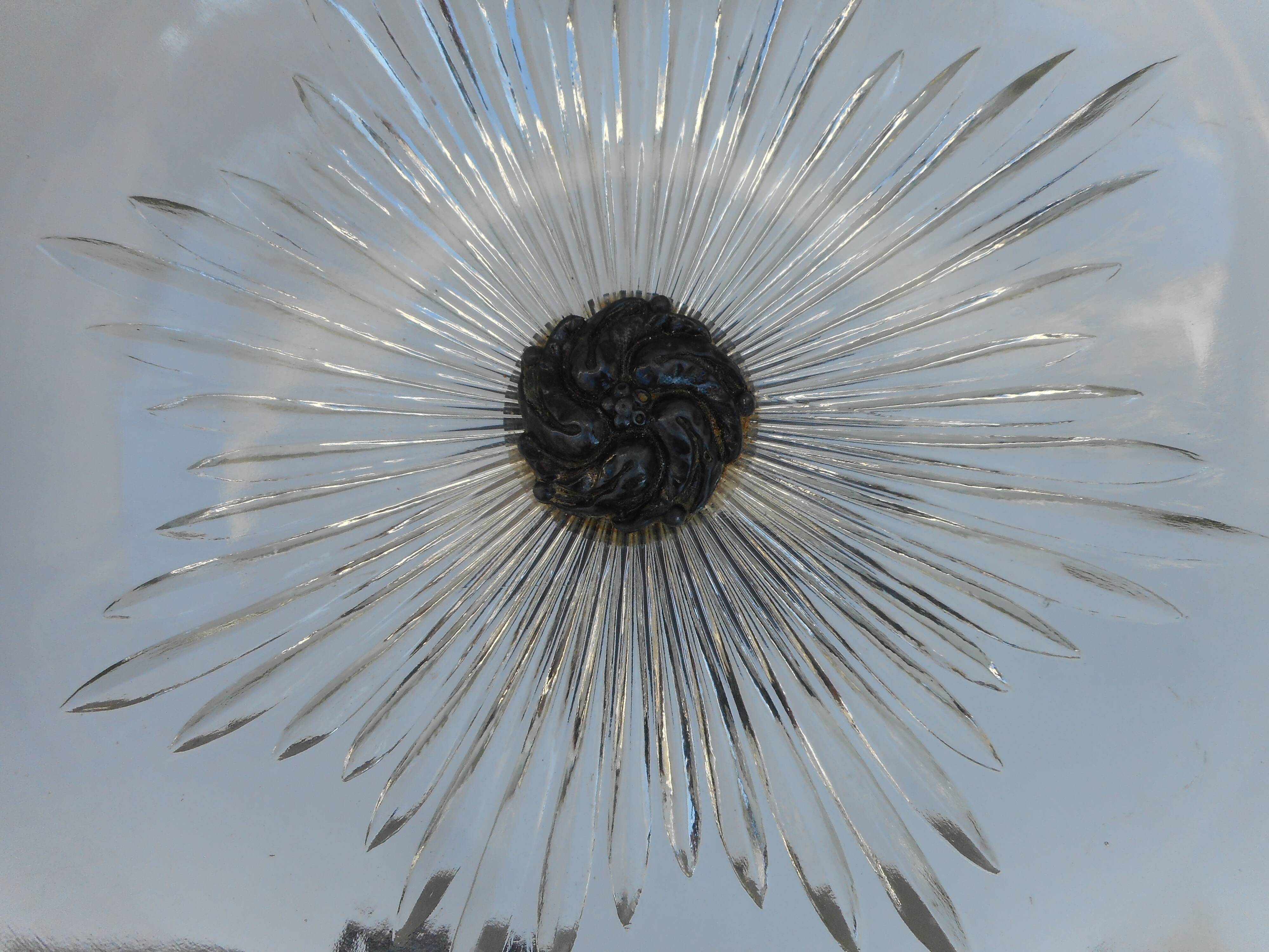 A glass cup on metal stand