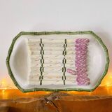 Plate of asparagus with a sauce.