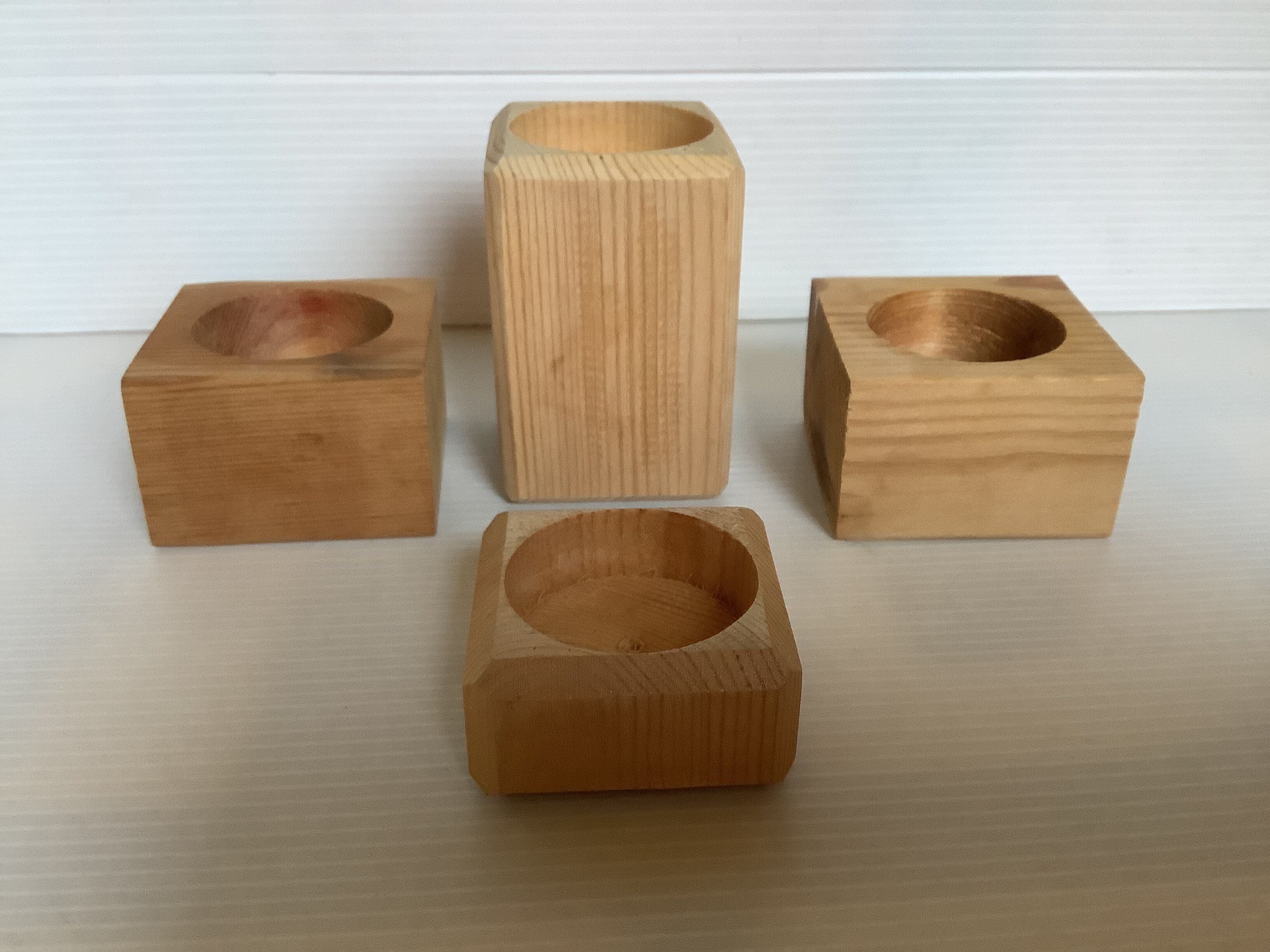 Set of four scandinavian wooden candle holders