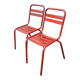 2 red metal Tolix-style chairs, France 1950