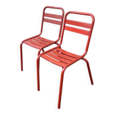 2 red metal Tolix-style chairs, France 1950