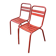 2 red metal Tolix-style chairs, France 1950