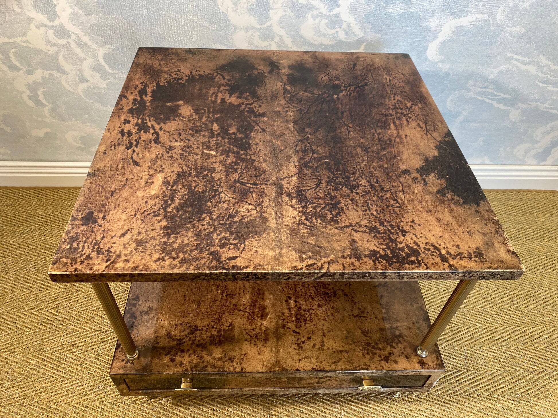 Aldo Tura side table in hazel brown tones with brass legs and bottom drawer