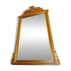 Large beveled mirror with a gilded frame depicting roses