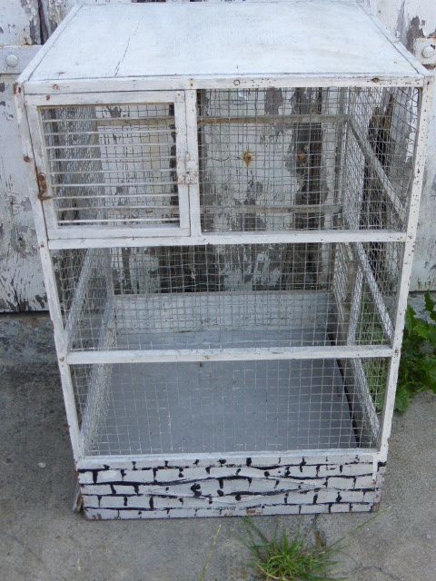 Vintage bird cage, made of wood and chicken wire metal square mesh