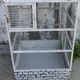 Vintage bird cage, made of wood and chicken wire metal square mesh