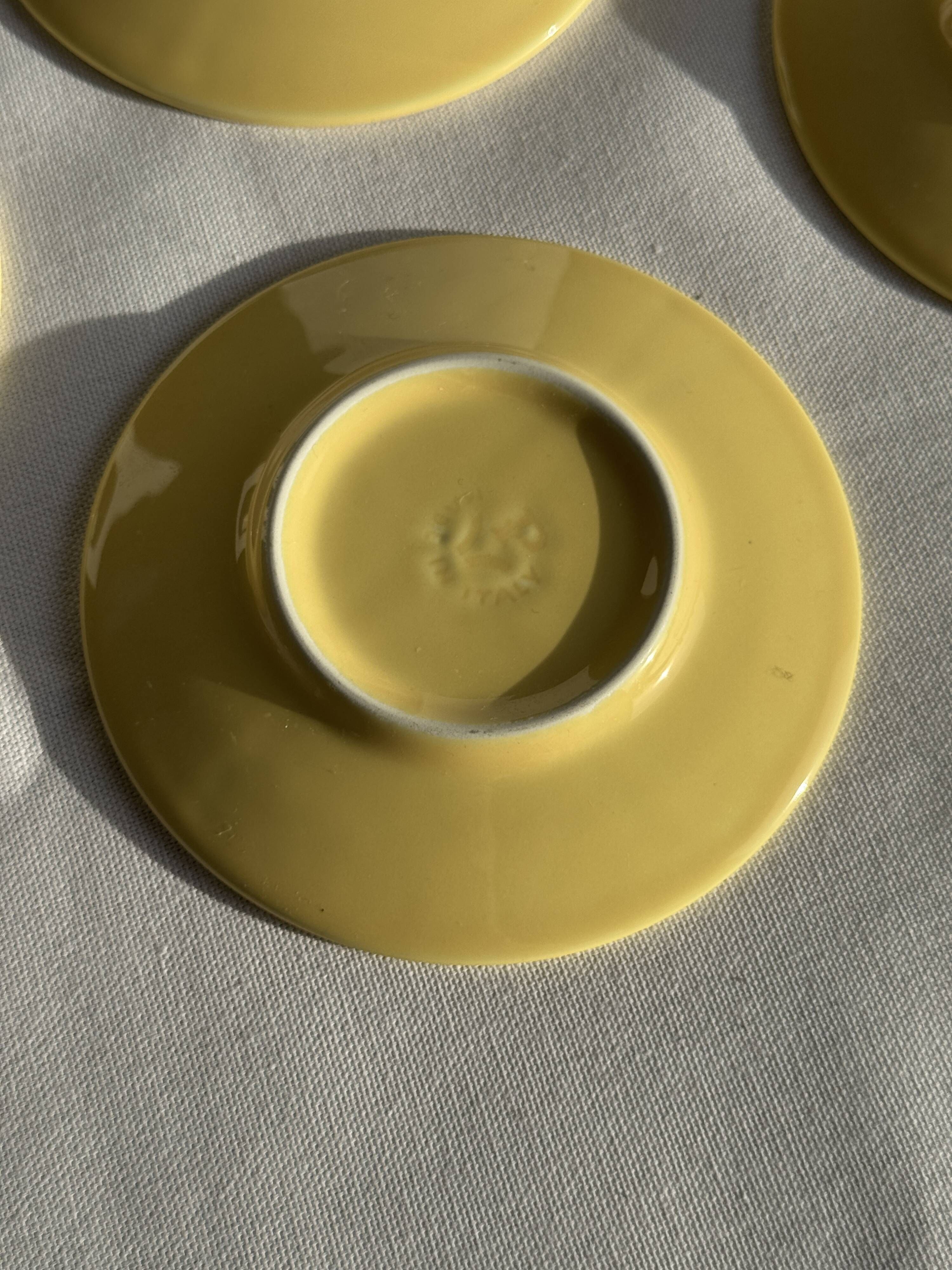 Set of 4 vintage yellow Italian espresso cups and saucers.