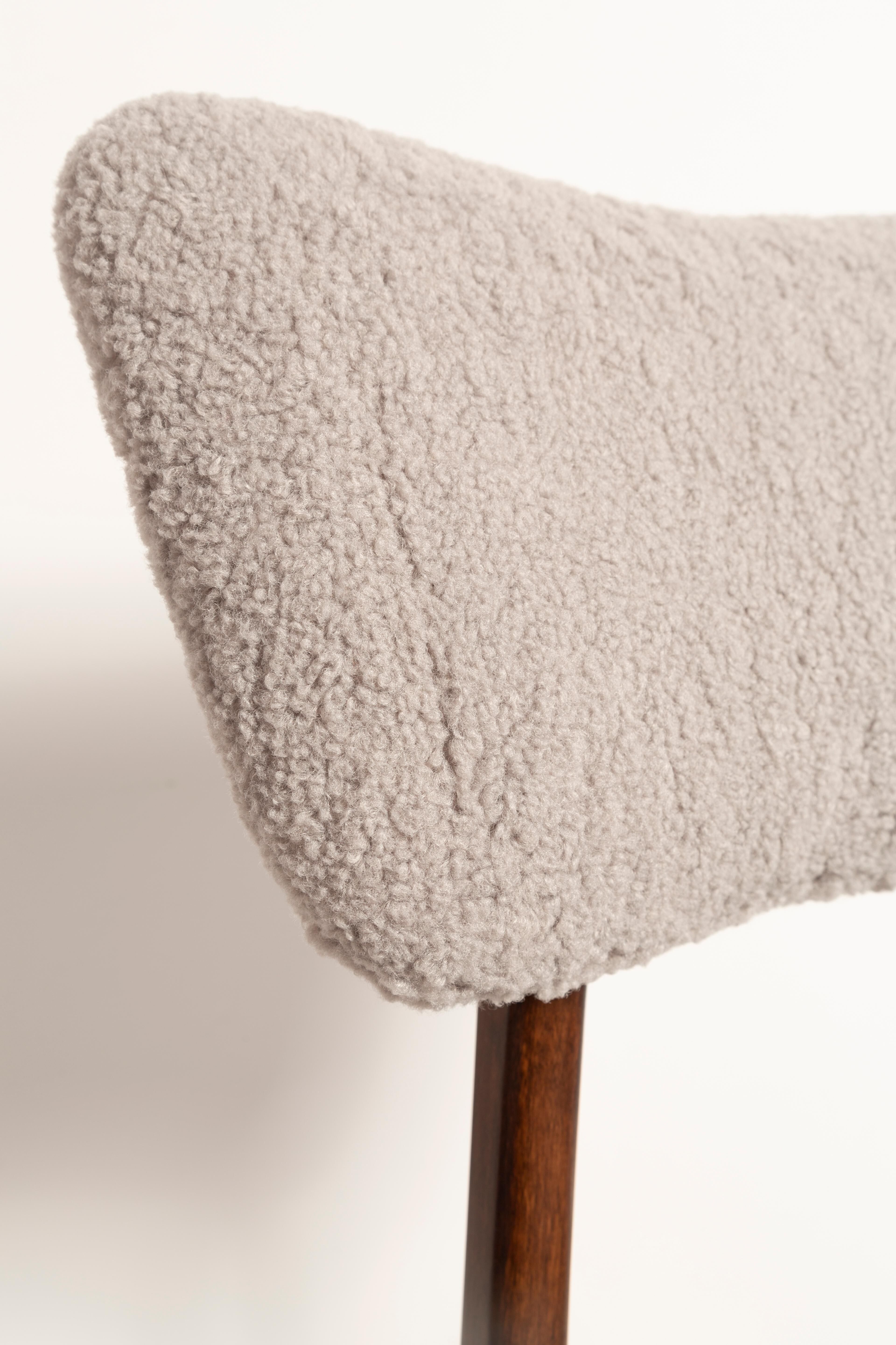 Mid-century butterfly chair, light grey boucle, dark walnut wood, Europe, 1960s.