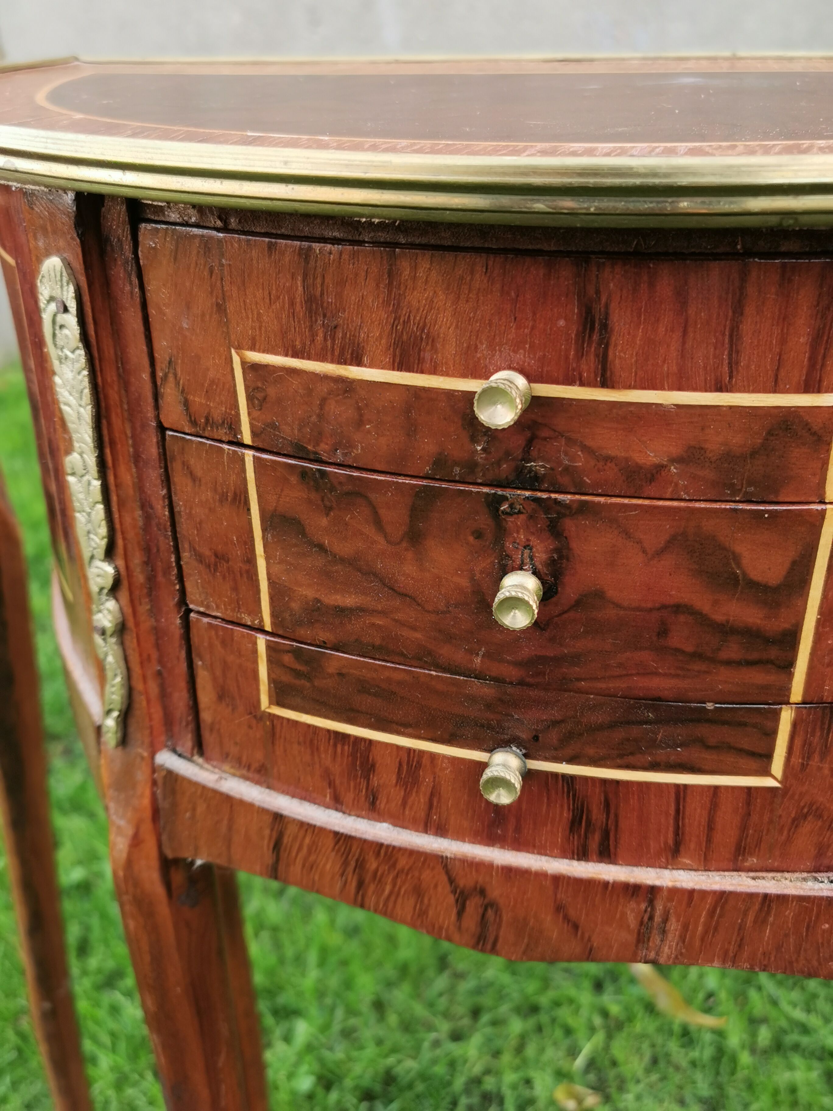 half-moon bedside pair in marquetry, bronze ornaments