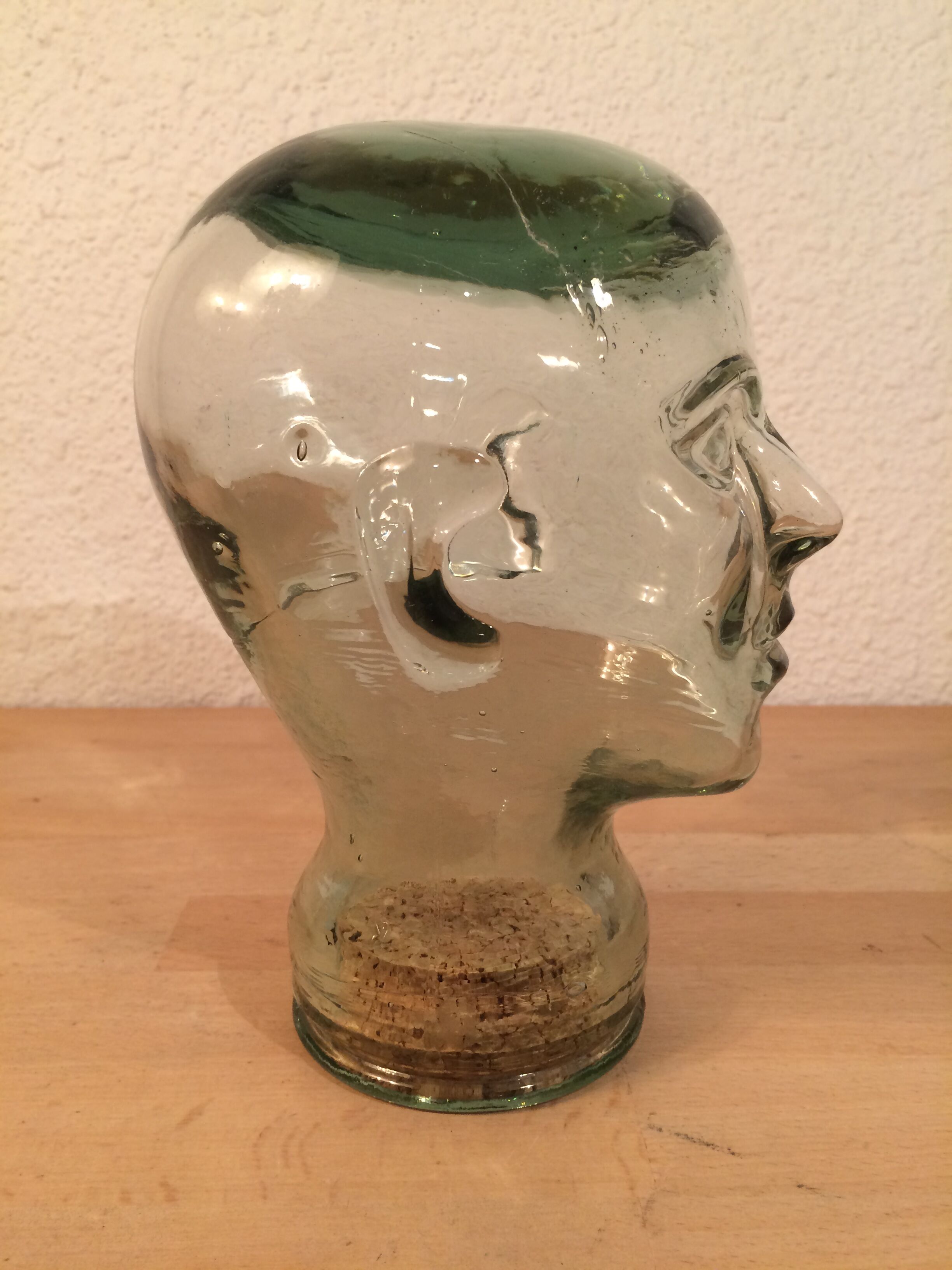 Molded glass head curiosity cabinet