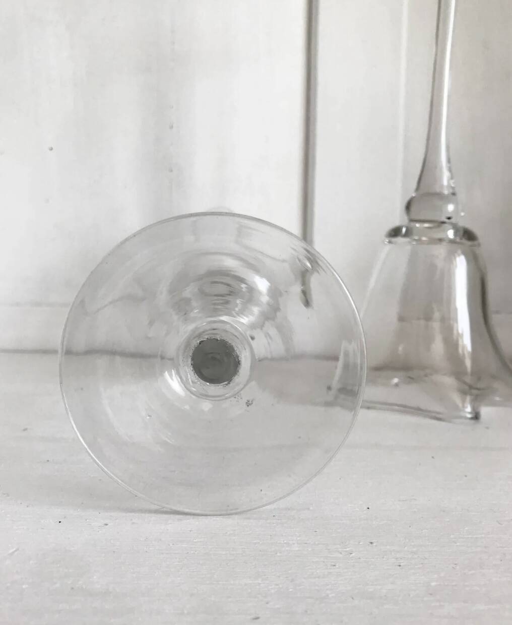 Pair of glass candlesticks on a stand