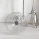 Pair of glass candlesticks on a stand