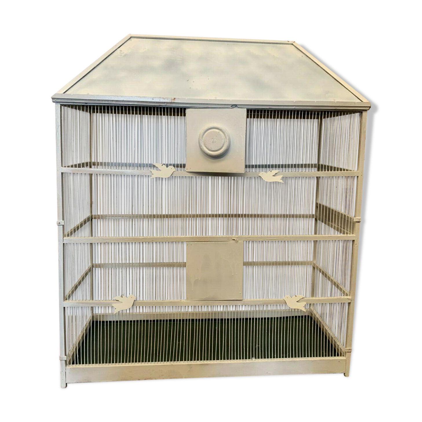 Cage has iron birds and prison volière has 20th century bars