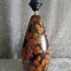 Carved wooden lamp with floral motif