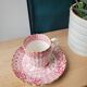 Fine porcelain coffee cup and saucer