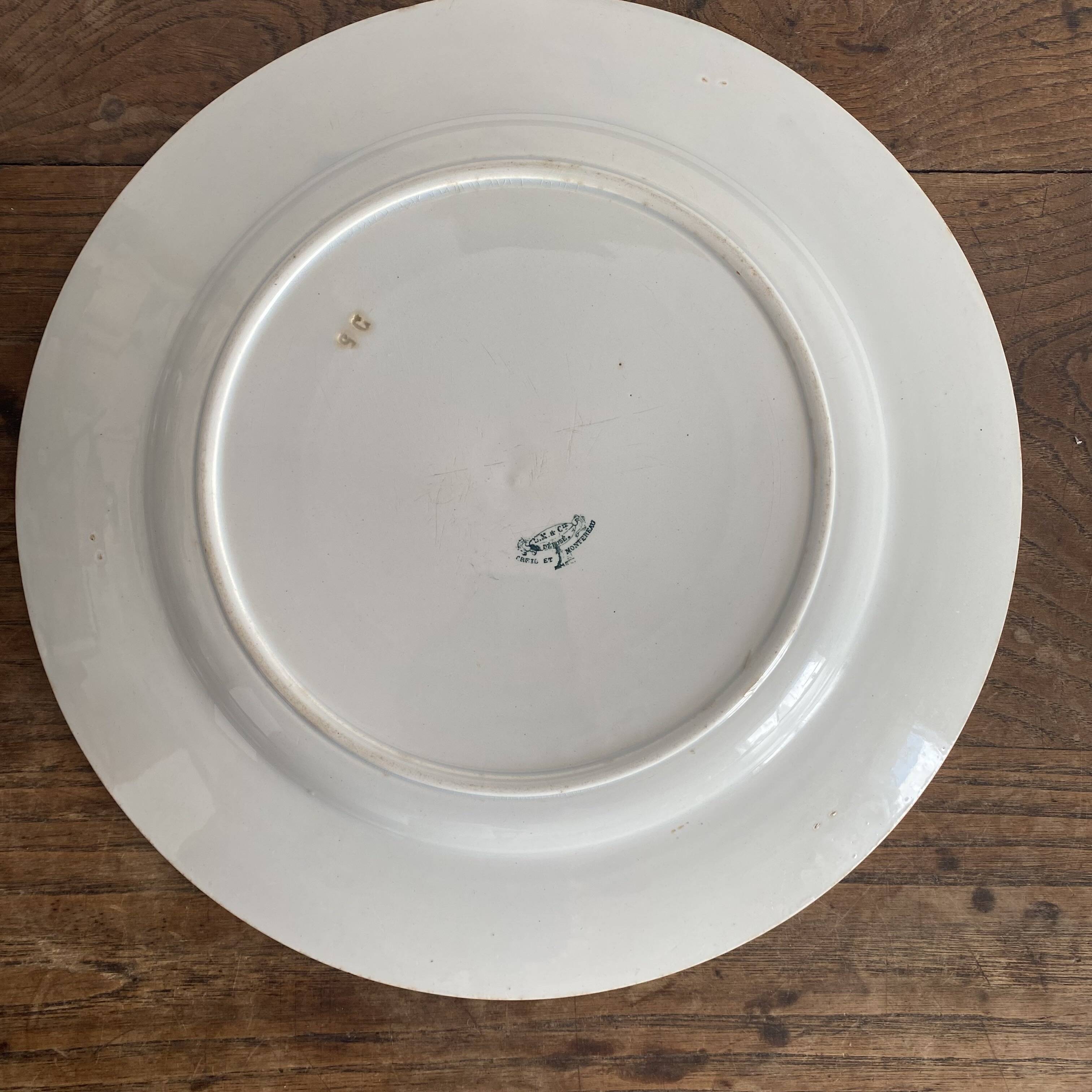 Set of large round white earthenware dishes from Creil and Montereau, 19th century