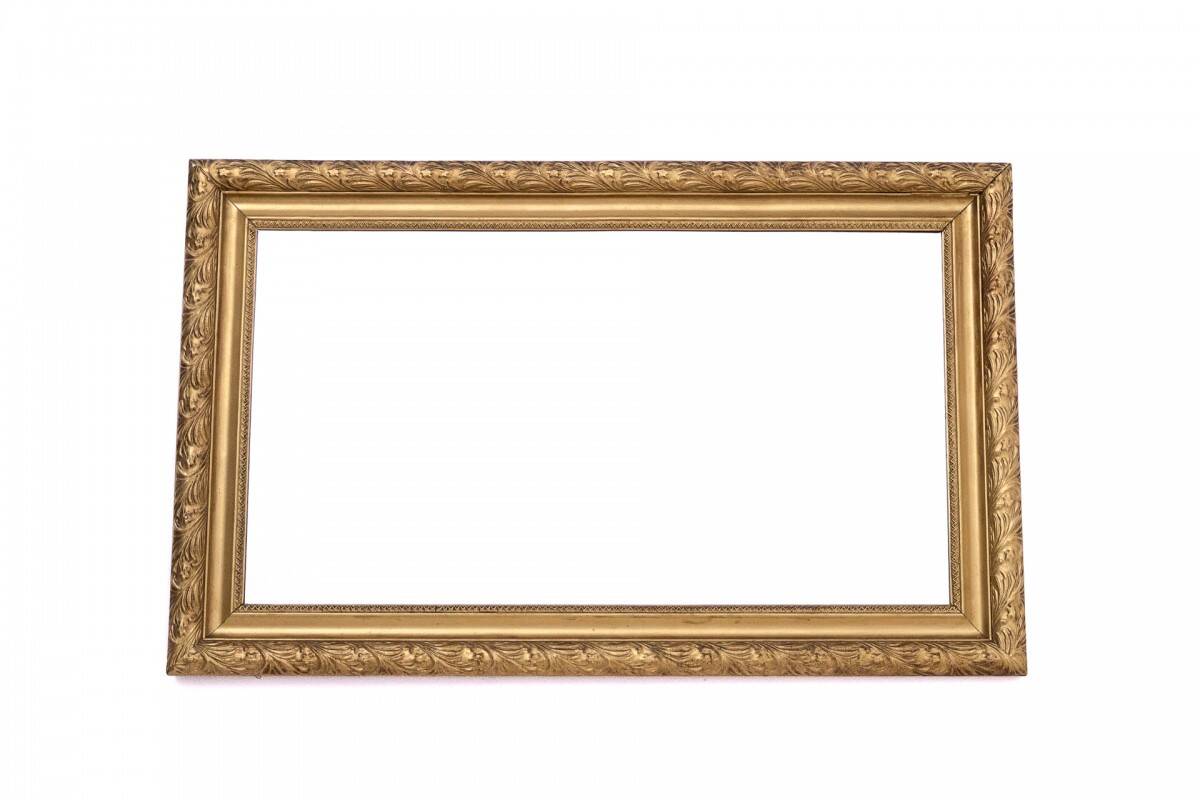 Horizontal mirror with a golden frame, France.