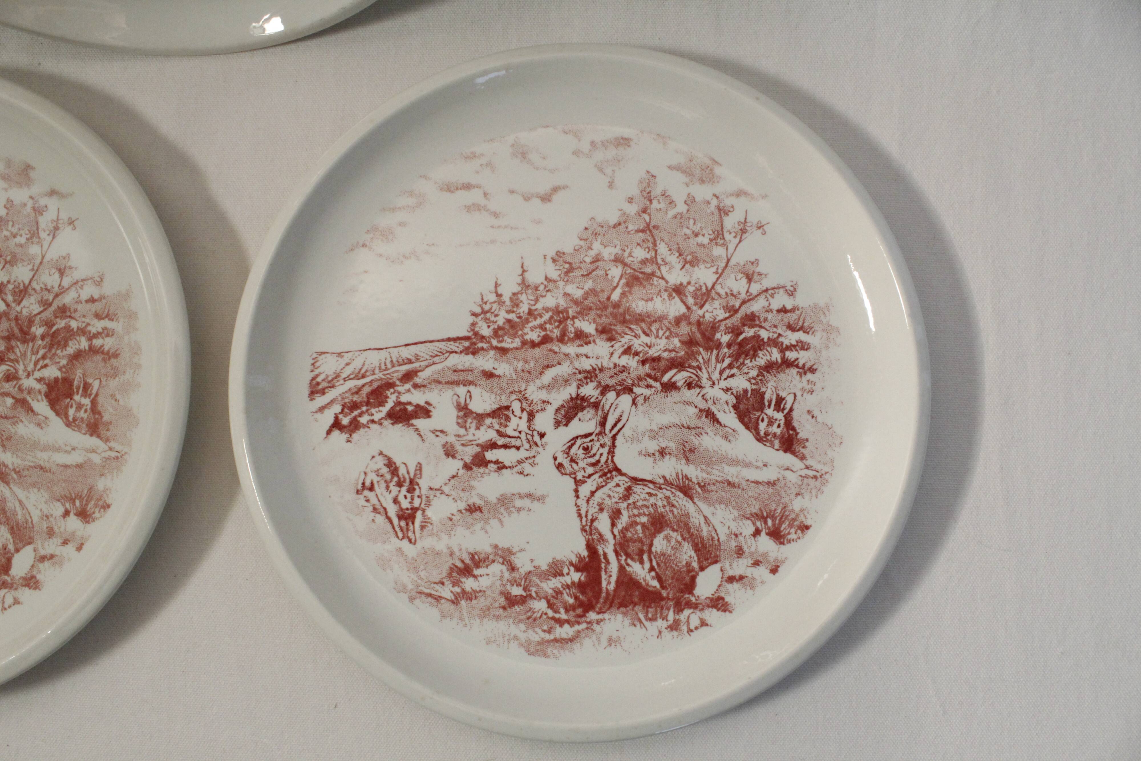 Set of 3 mismatched flat plates - red/burgundy decorations - deer and hare