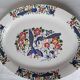 Large oval white ceramic platter, decorated with peacocks and vintage flowers