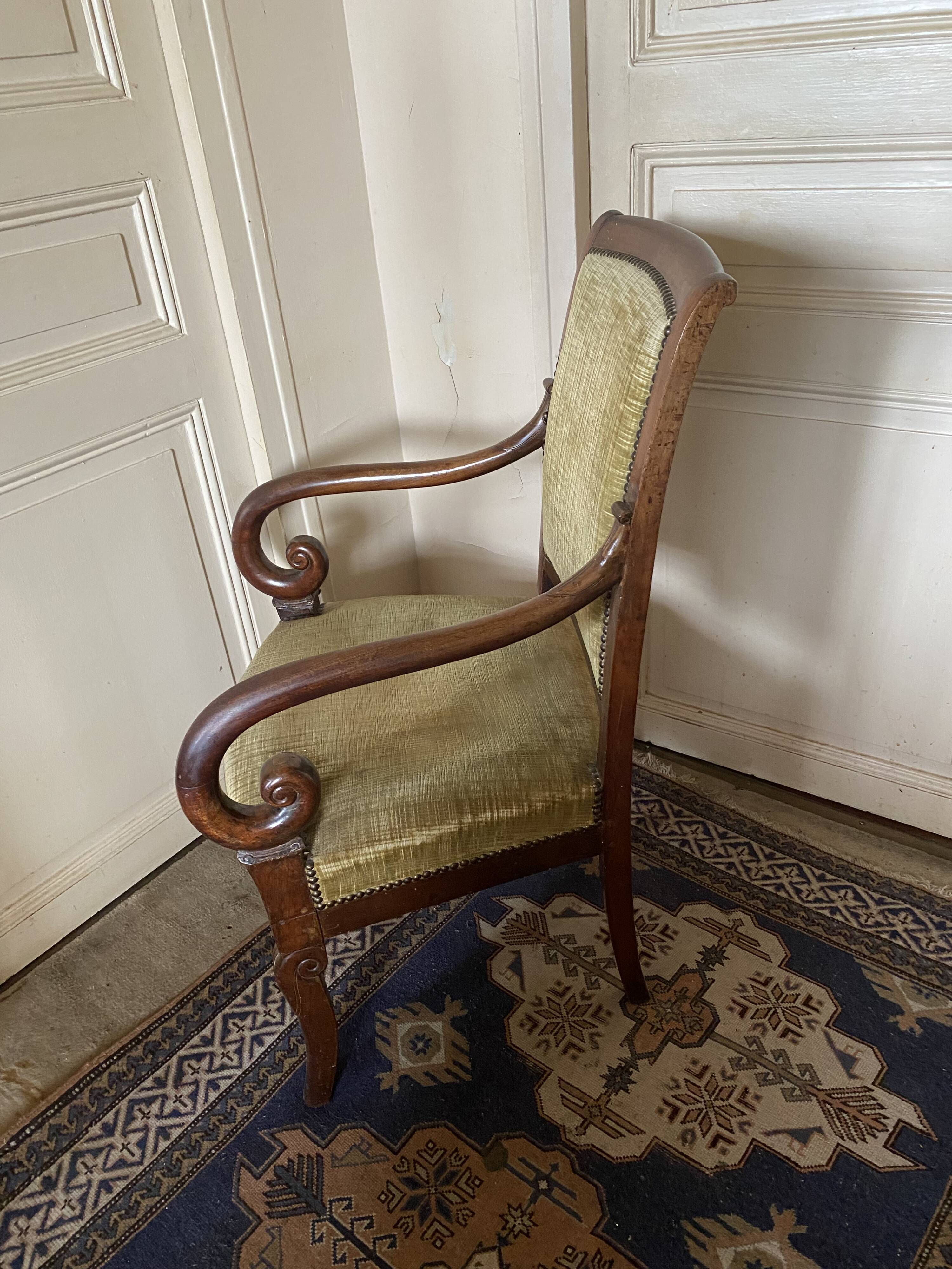 Armchair with a scroll, upholstered in green velvet