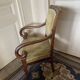 Armchair with a scroll, upholstered in green velvet