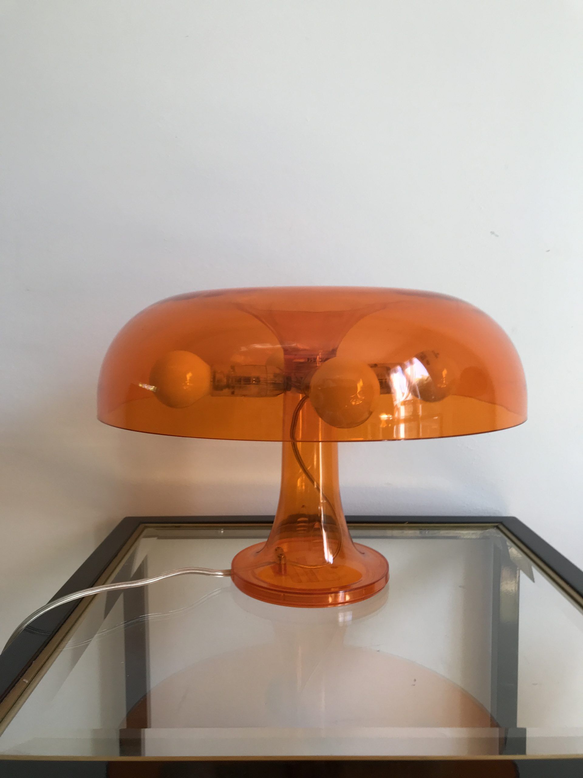 Orange nessino pose lamp for artemide by giancarlo mattioli