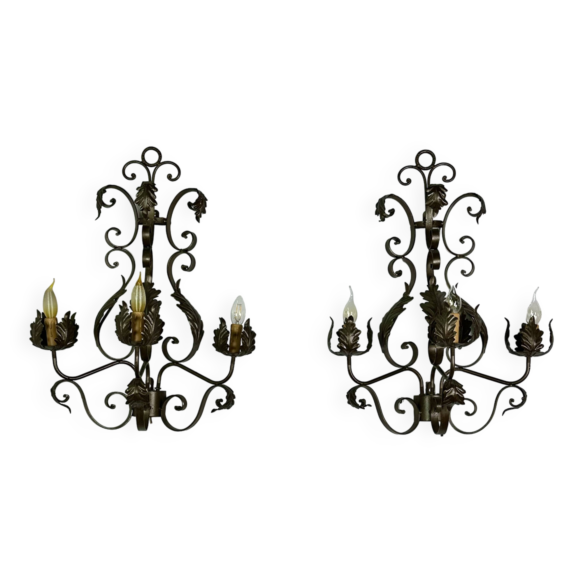 Wrought iron wall lights (pair) with foliage decoration