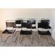 Series of 6 minimalist chairs in chrome metal and black leather around 1970