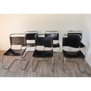 Series of 6 minimalist chairs in chrome metal and black leather around 1970