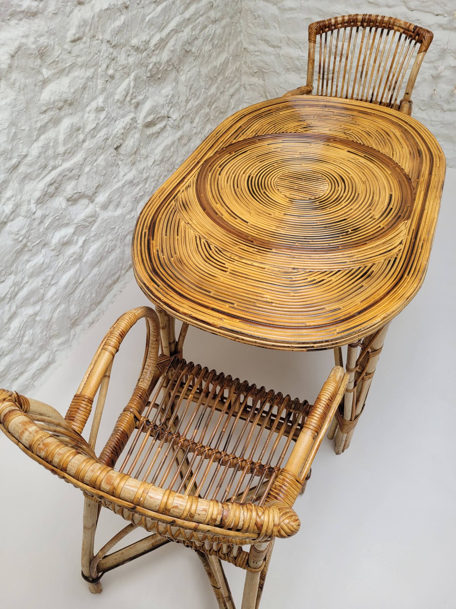 Vintage Audoux Minet bamboo, rattan, and smoked glass table duo.