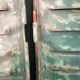 Lot of old green shutters in 4-part iron screen headboard