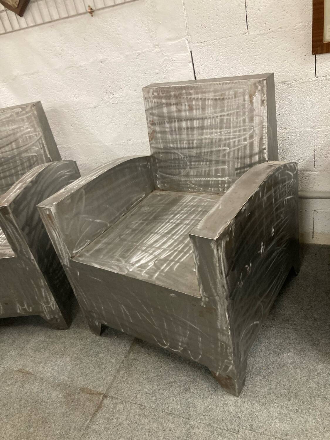 Pair of industrial metal armchairs