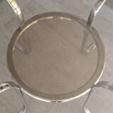 Round table in chromed metal and smoked glass