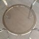 Round table in chromed metal and smoked glass