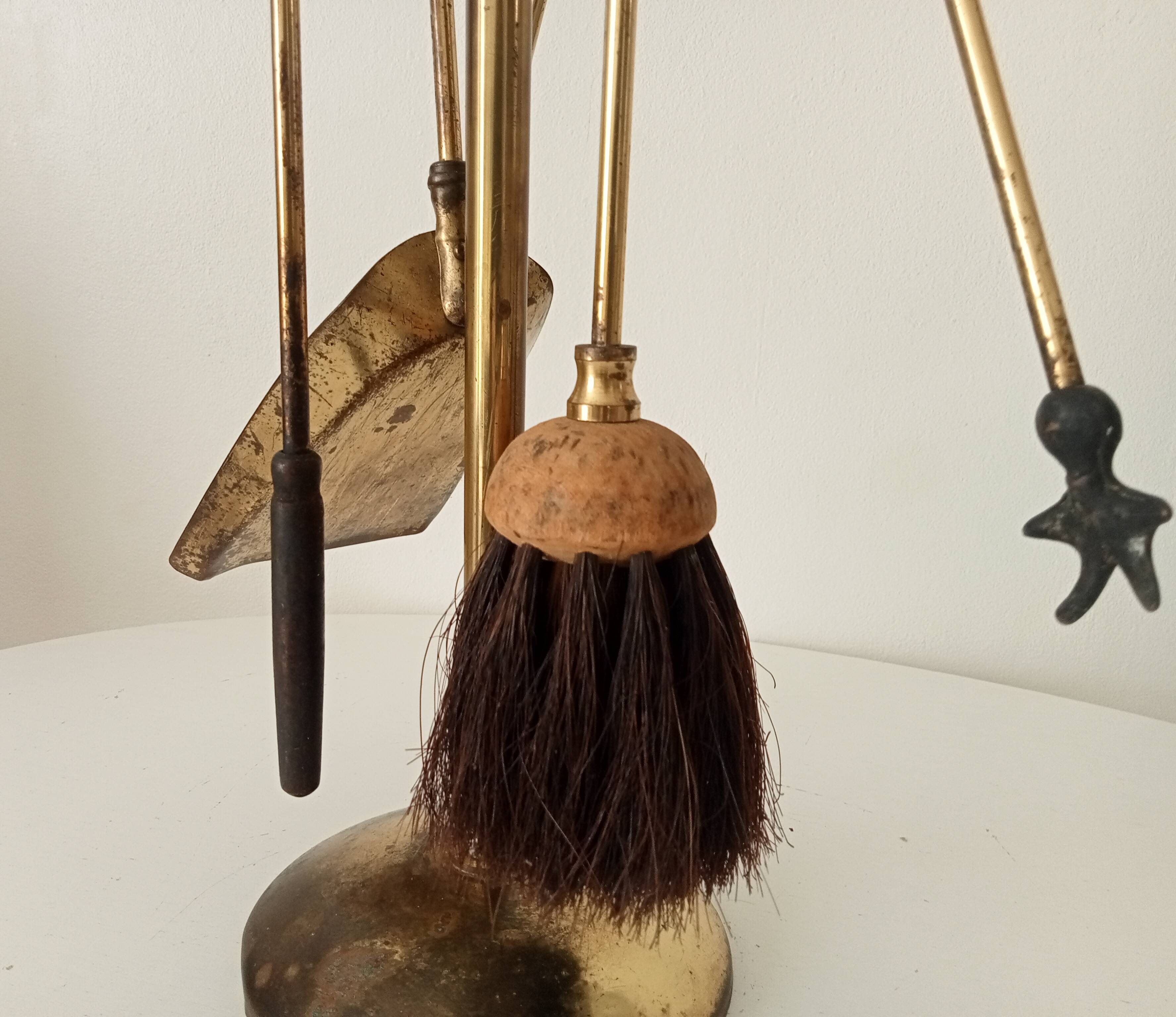 Old brass fireplace servant