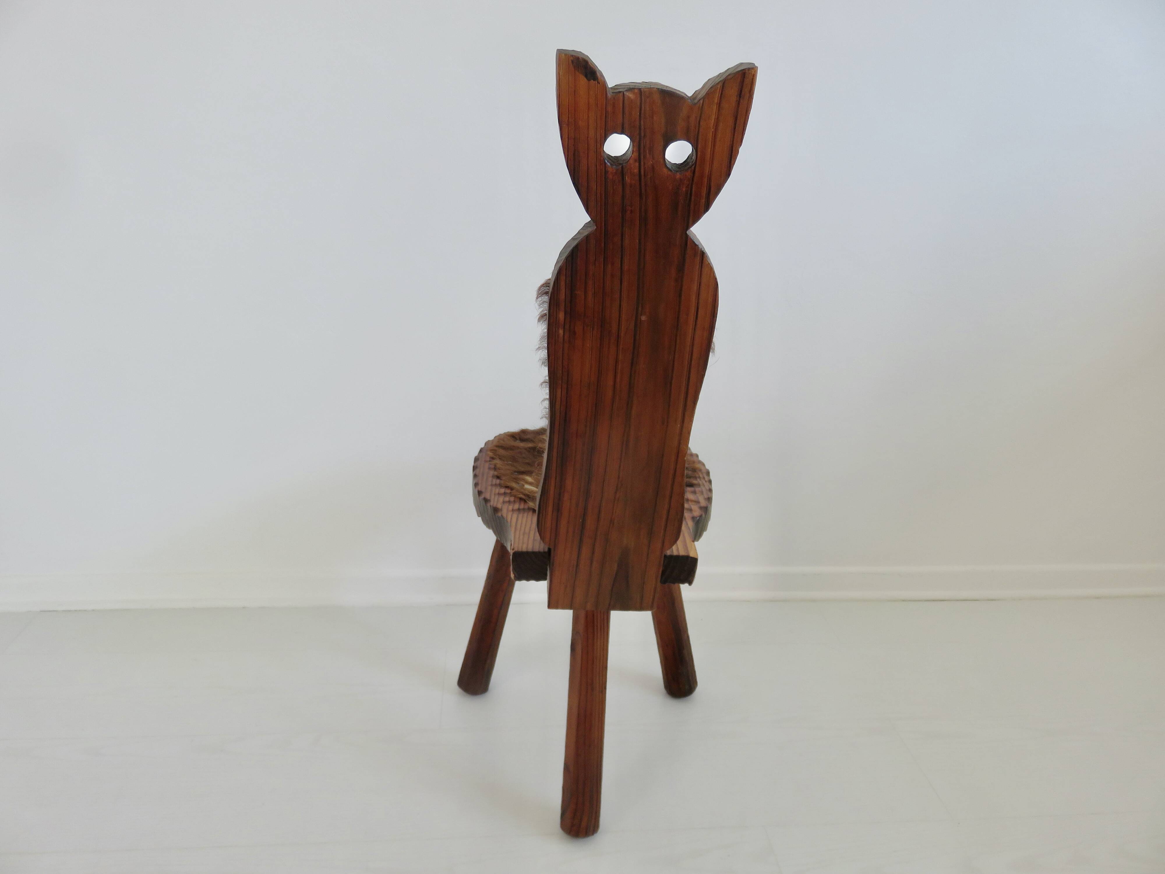 Brutalist cowhide tripod stool in solid wood