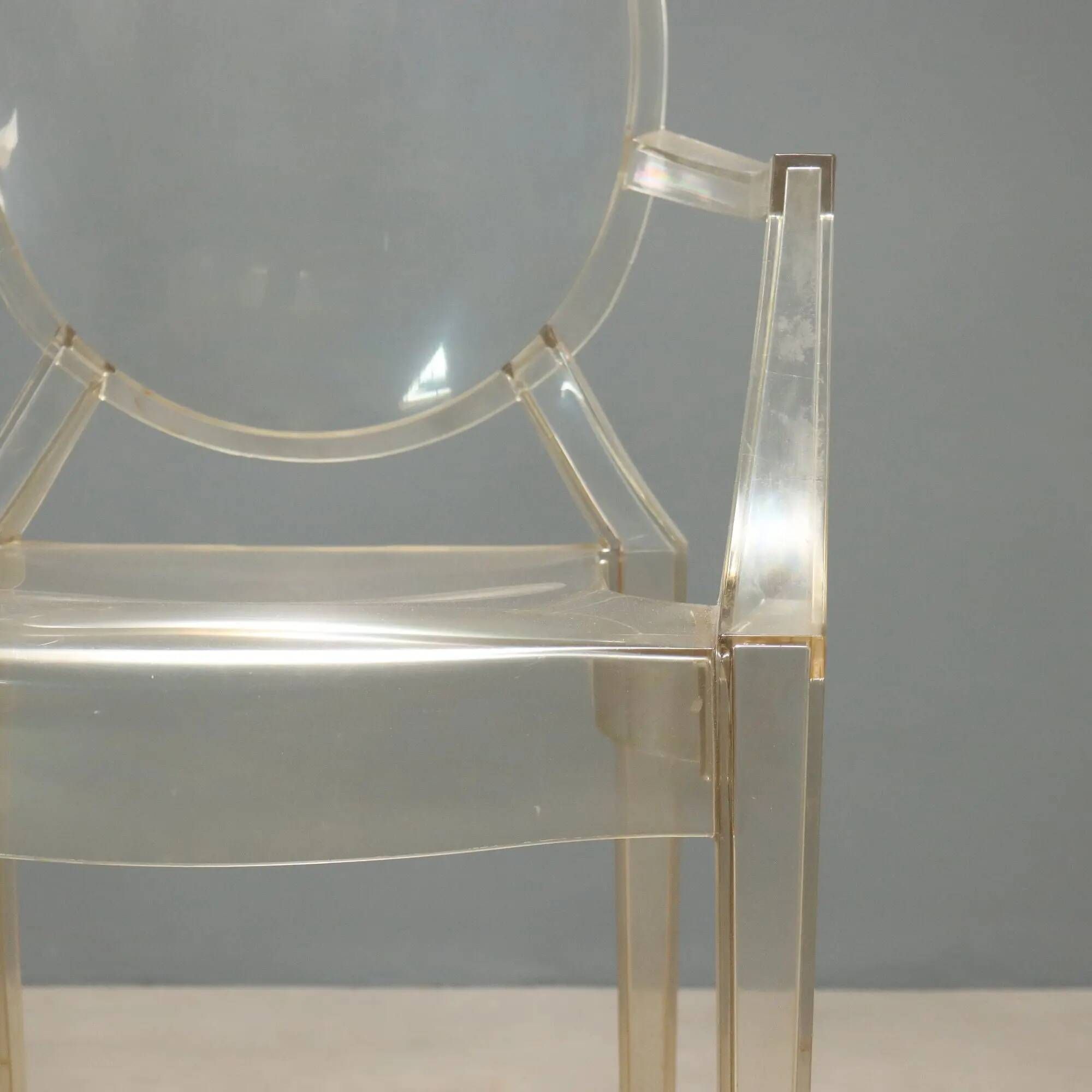 Louis Ghost chairs by Kartell designed by Philippe Starck from the 2000s.